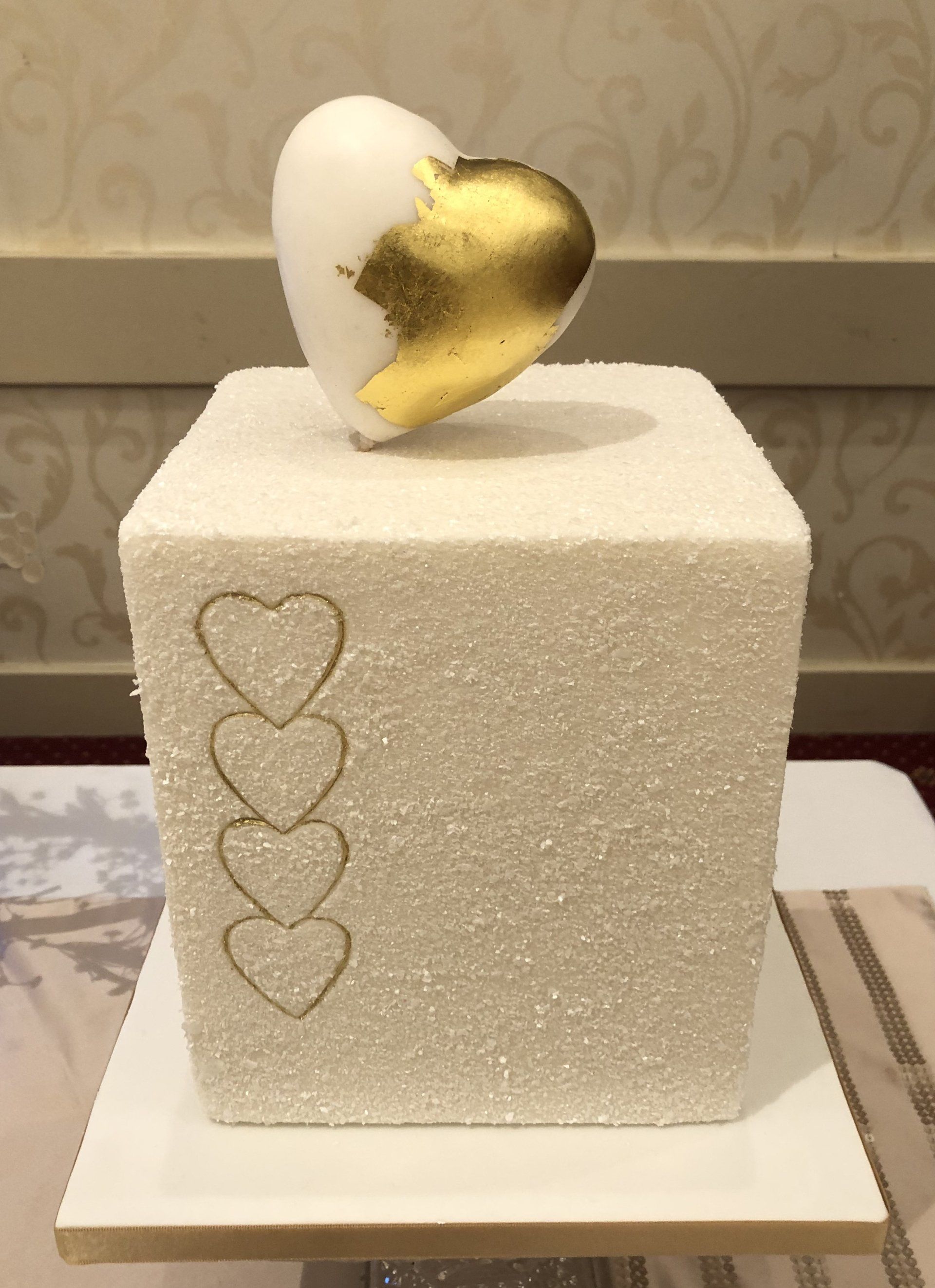 A white cake with the name,