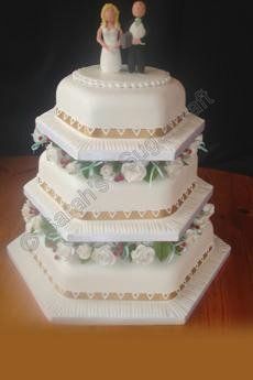 A three tier traditional wedding cake.