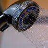 Showerhead with water spraying out.