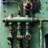 Green industrial pipes and valves.