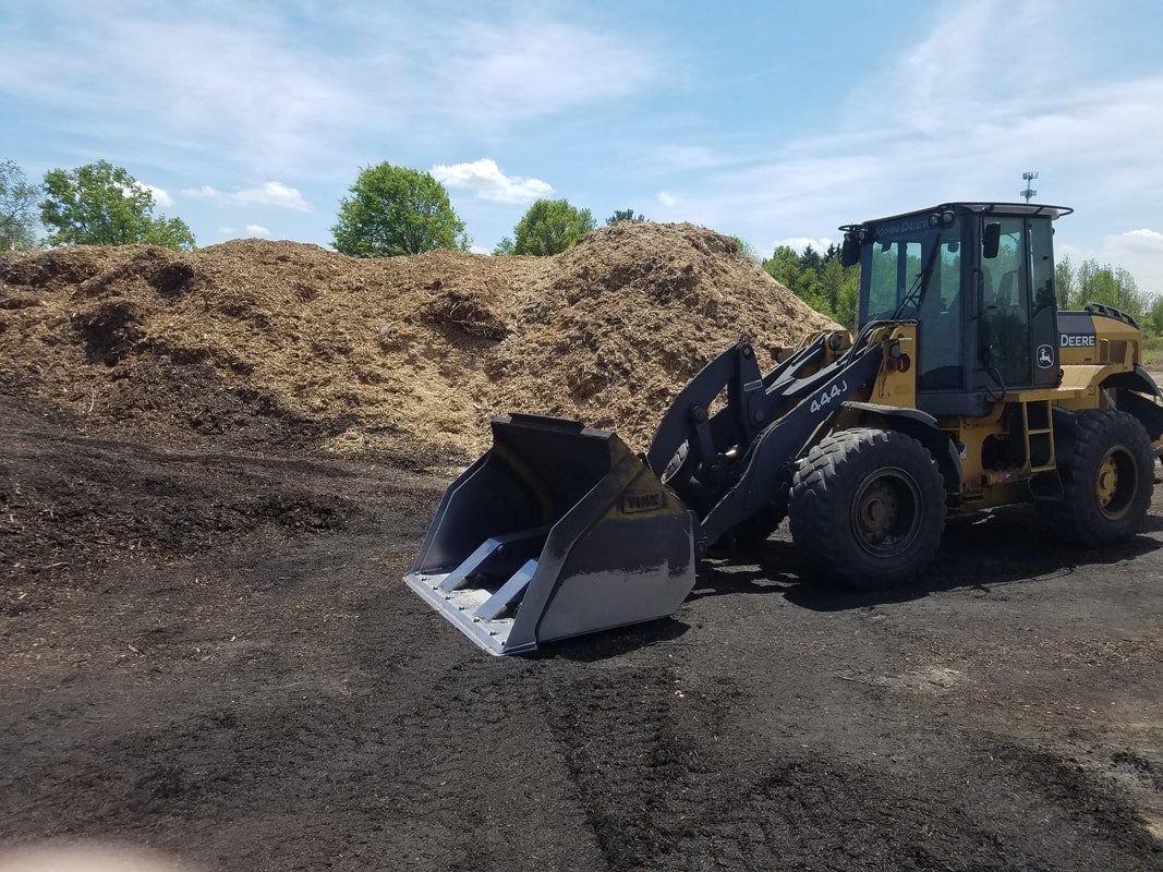 Wood Chips and Wheel Loader on Site — Monroe Township, NJ — Slammin Canz, Inc.