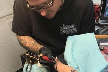 tattoo artist at work tattoo artist at work