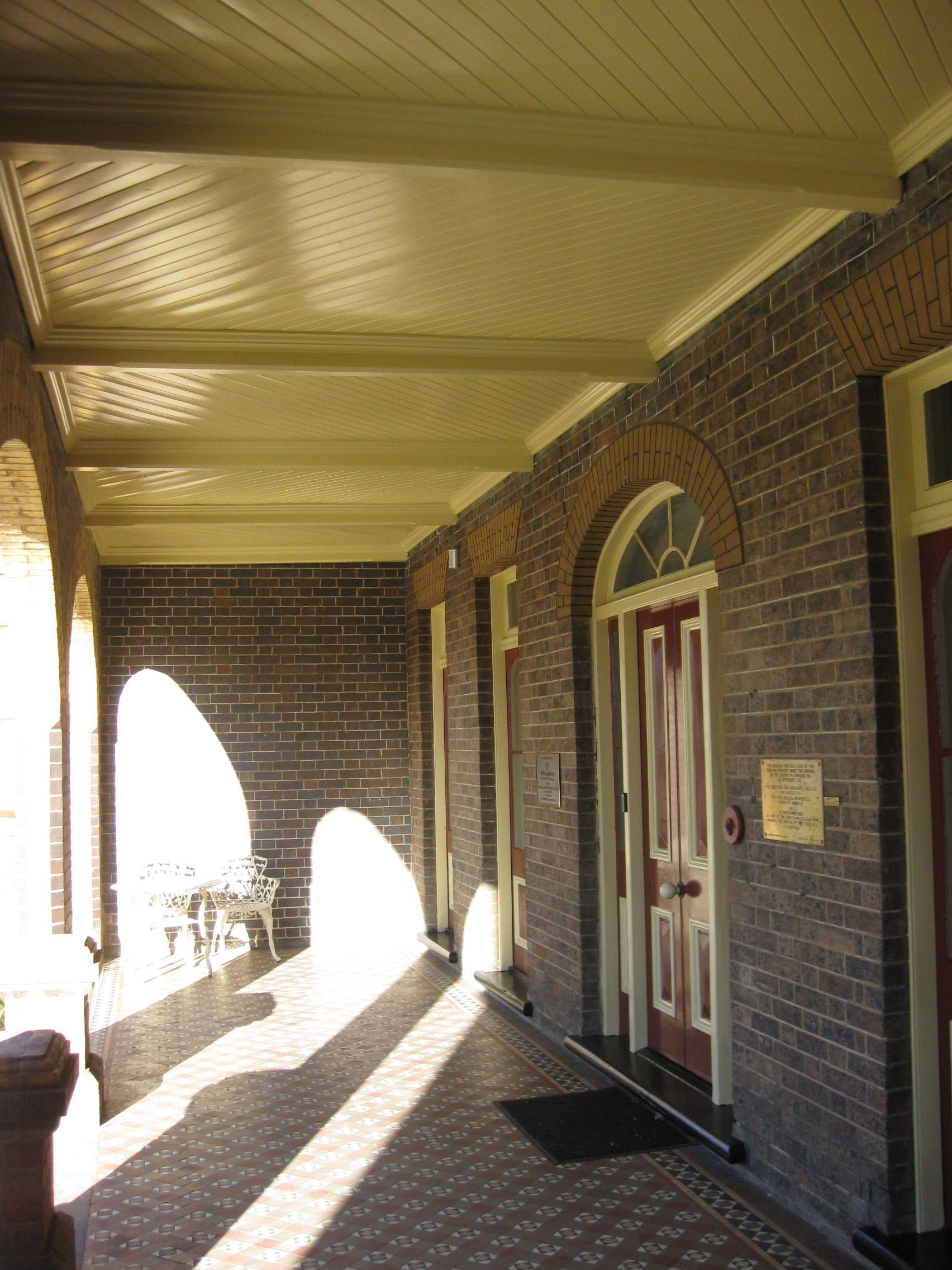 Catholic cathedral precinct brick building with a porch and a door
