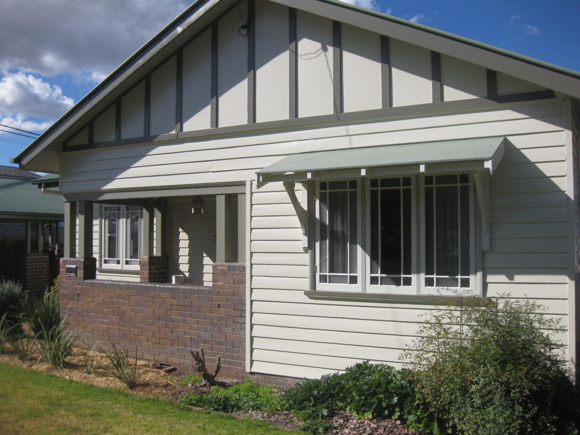 View of heritage style home from the front yard