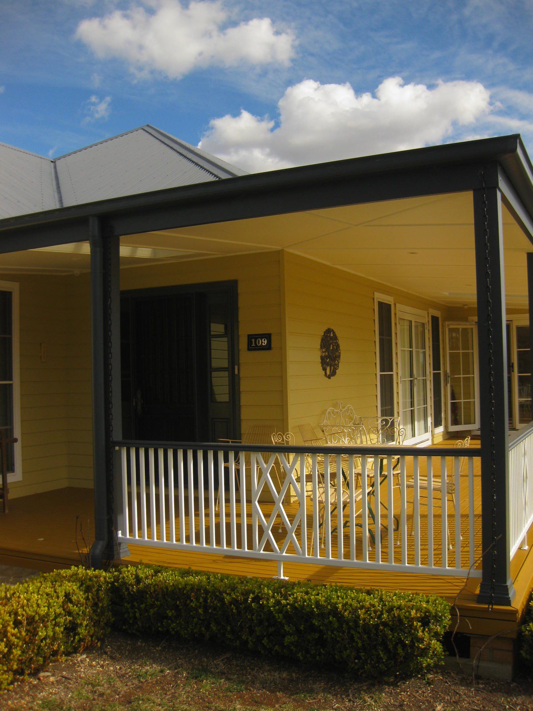 front of home painted yellow