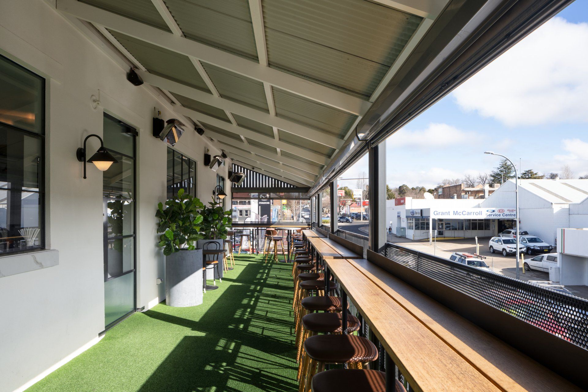 balcony bar seating looking out onto the street at the whitebull hotel