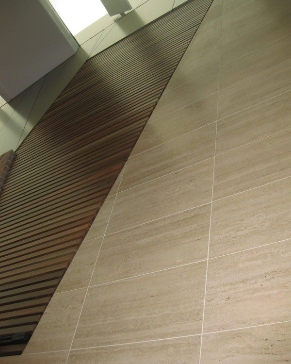 a tiled decoration wall with a wooden feature 