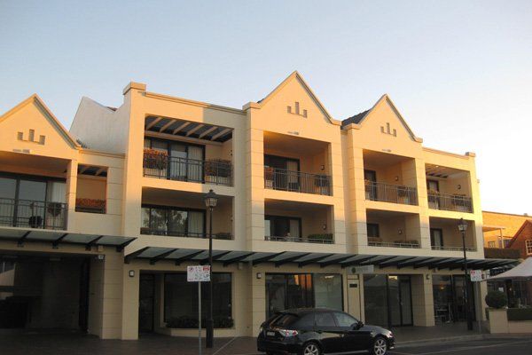 Exterior front view of mews on moore building painted cream in armidale