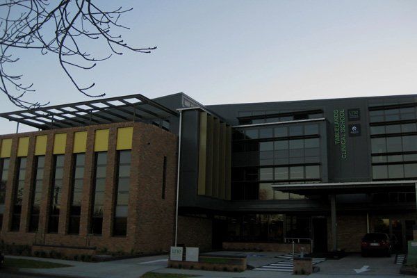 wide view of tablelands clinical school in the evening