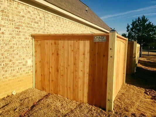 Residential Fence — House with Wood Fence in Pearl, MS
