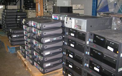 Go-Recyclers / computer recycling / free computer recycling A bunch of computer cases stacked on top of each other