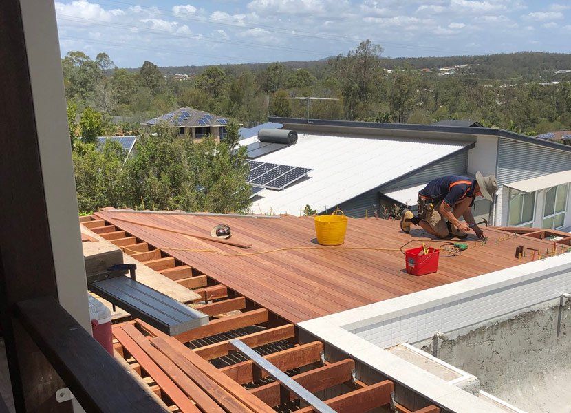 laying down wood patio