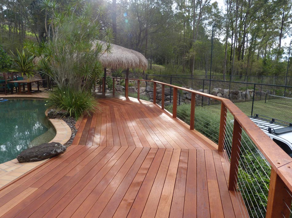 long wood deck with railing