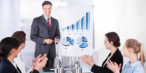man finishing a presentation