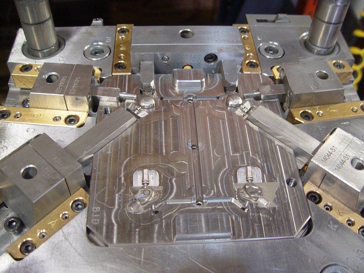 A metal mould with a few holes in it