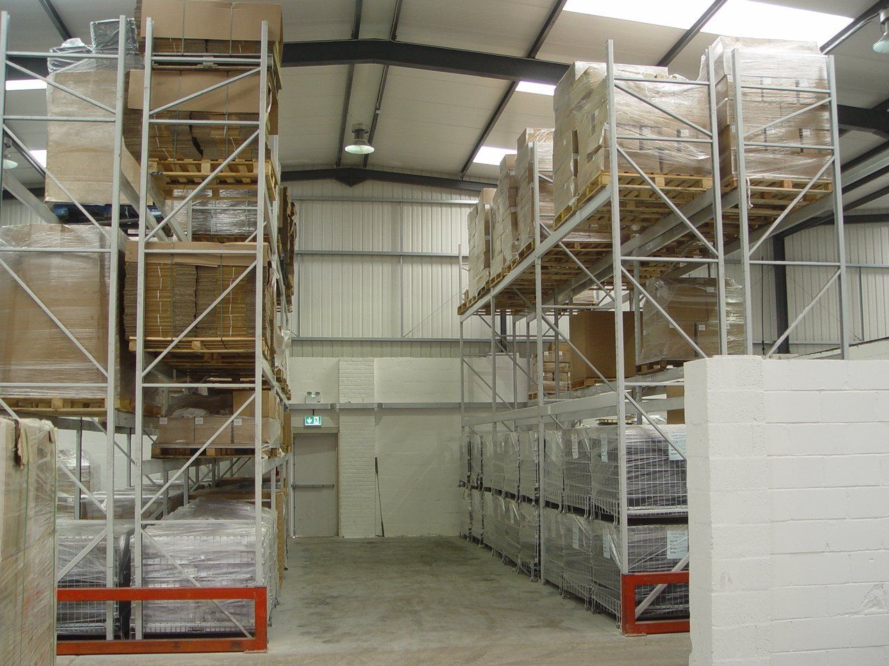 A warehouse filled with lots of shelves and boxes