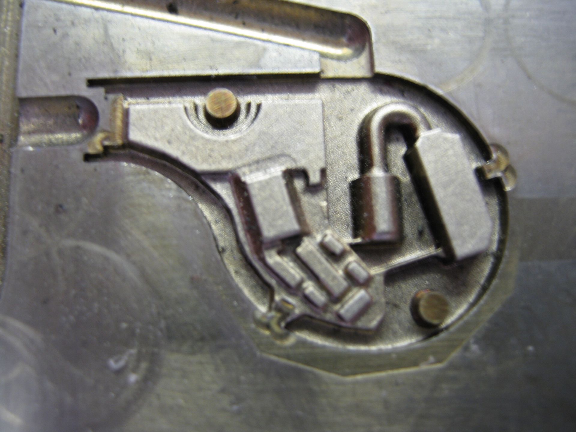 A close up of a piece of metal with a padlock on it