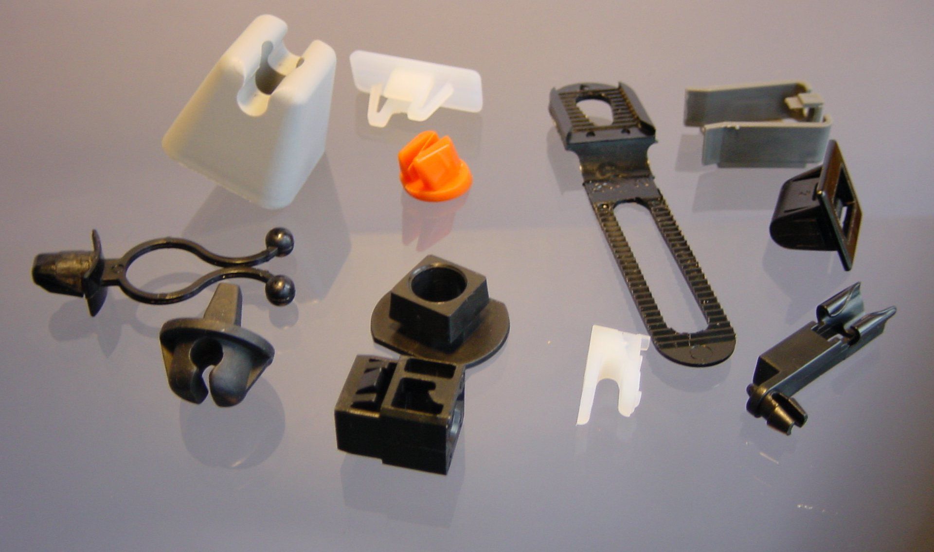 A bunch of plastic clips are on a table