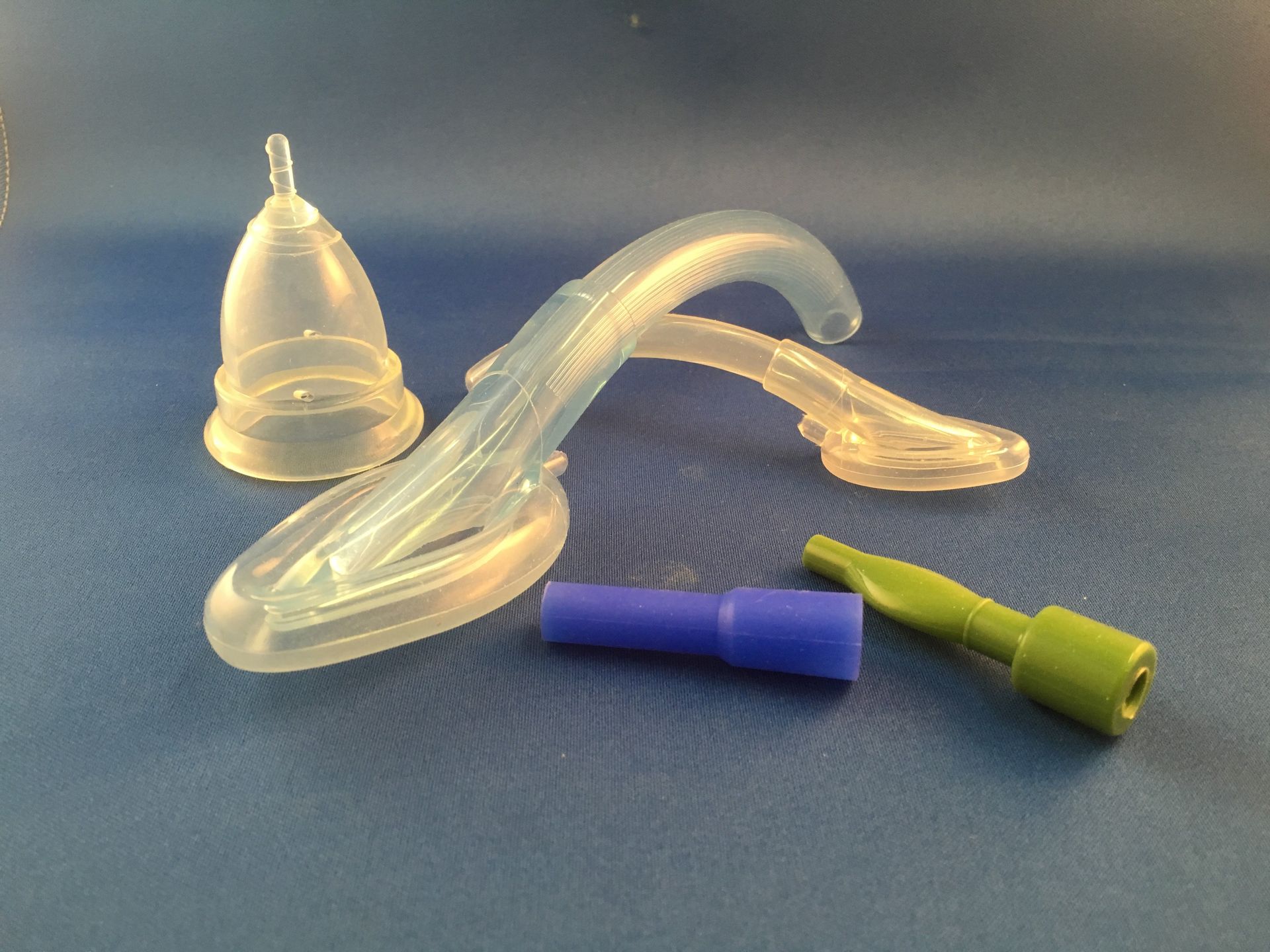 A group of plastic objects on a blue surface