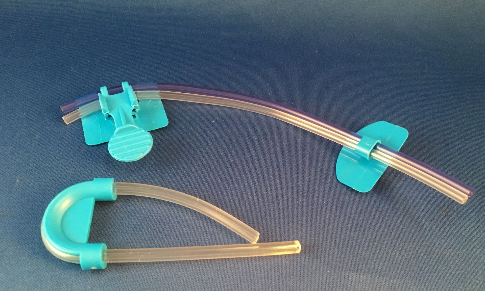 A blue hose with a blue clip on it