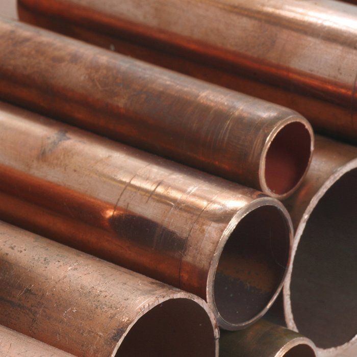 Copper pipes in varying sizes, stacked.