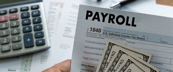 Business — Payroll Form with Money and Calculator in Skokie, IL Business — Payroll Form with Money and Calculator in Skokie, IL