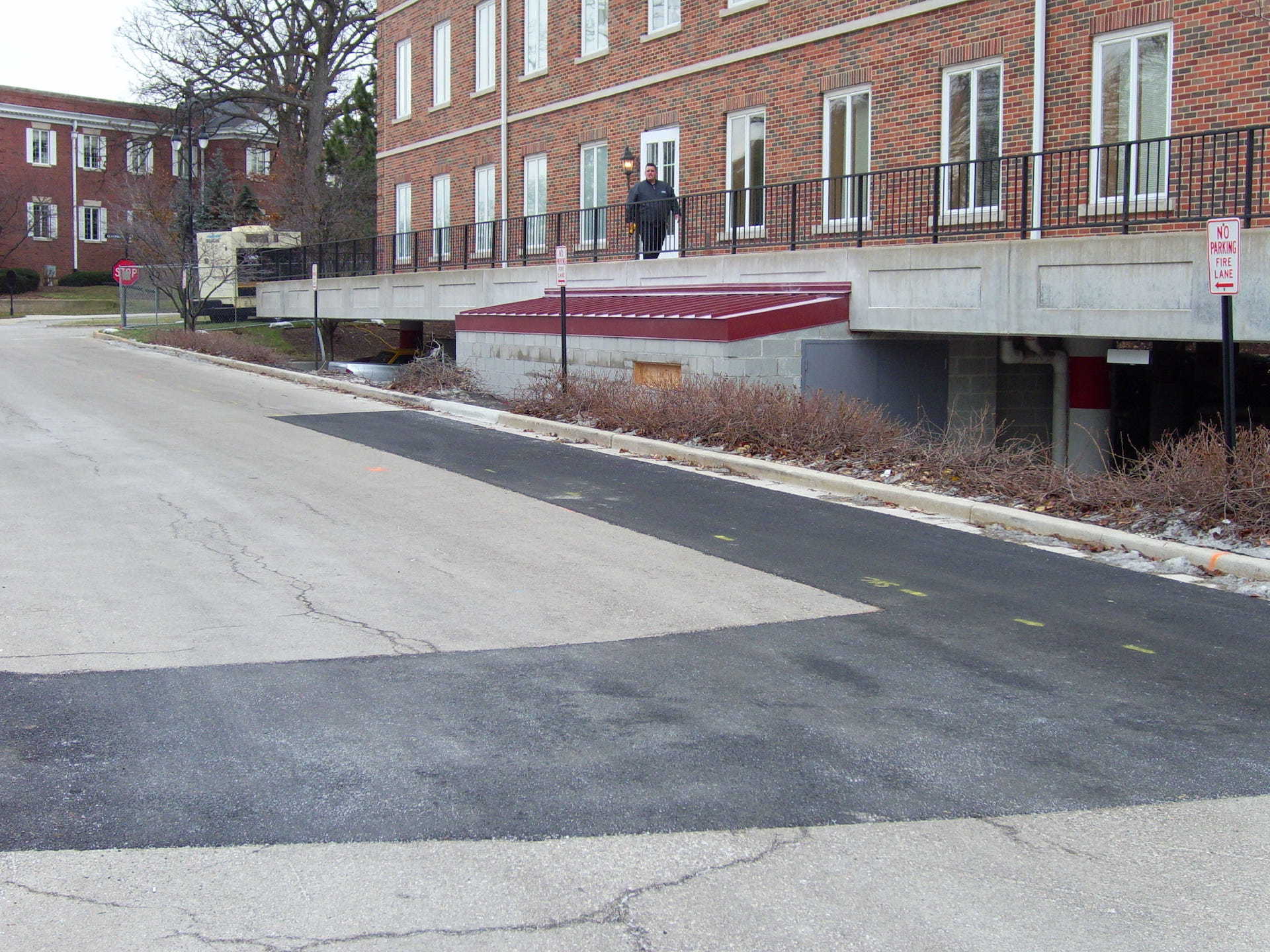 A brick building with a no parking sign in front of it