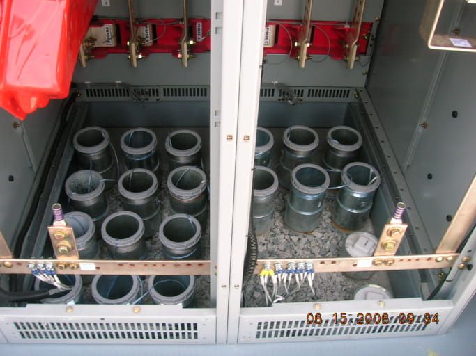 Two electrical cabinets with a lot of tubes in them