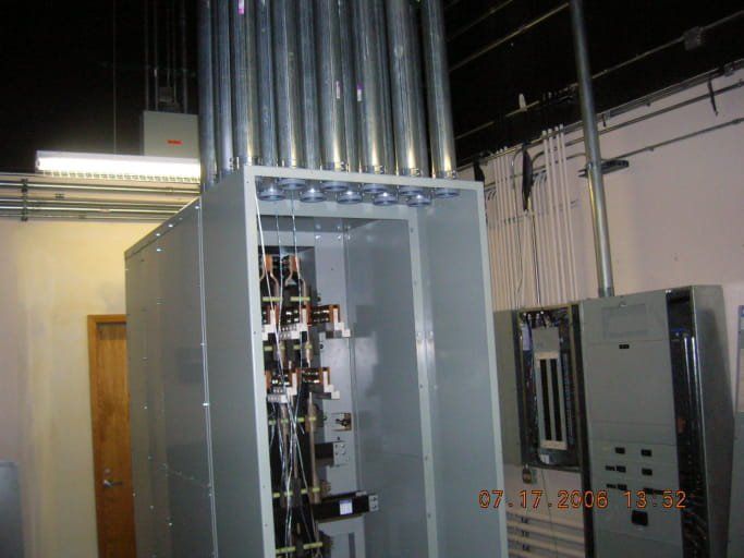 A large electrical box with a lot of wires coming out of it