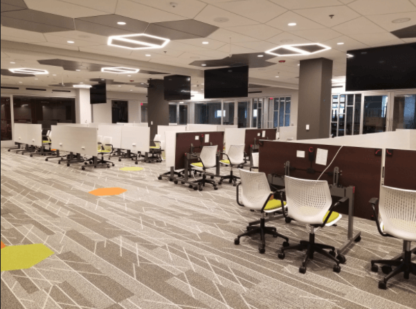 A large room with a lot of chairs and tables