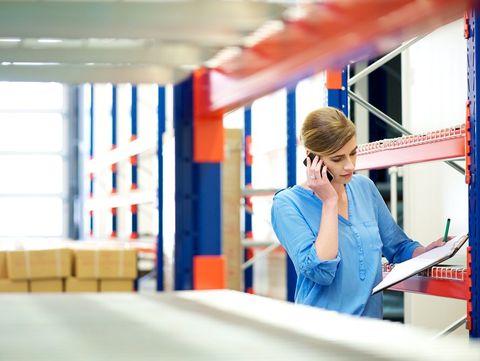 Huntsville Logistics — Woman Checking Inventory in Warehouse in Huntsville, AL Huntsville Logistics — Woman Checking Inventory in Warehouse in Huntsville, AL