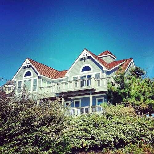 Large House With Trees — Powells Point, NC — Coastal Roofing & Siding Inc