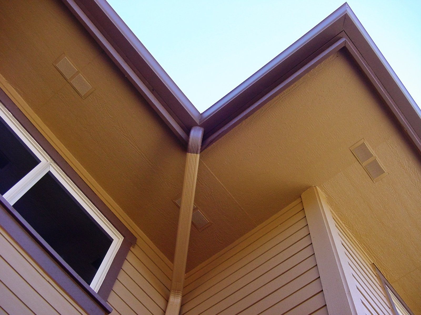 New Beige Vinyl Siding — Powells Point, NC — Coastal Roofing & Siding Inc New Beige Vinyl Siding — Powells Point, NC — Coastal Roofing & Siding Inc