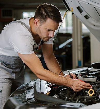 Mechanic Working with Car Diagnostic Tool — New Britain, CT — The Transmission Works Mechanic Working with Car Diagnostic Tool — New Britain, CT — The Transmission Works