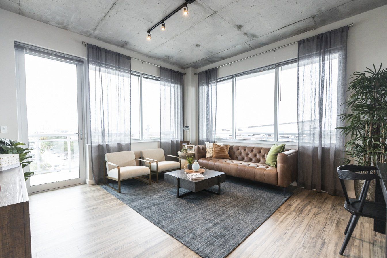 Apartment Living Room with Expansive Window Walls at Vantage St. Pete