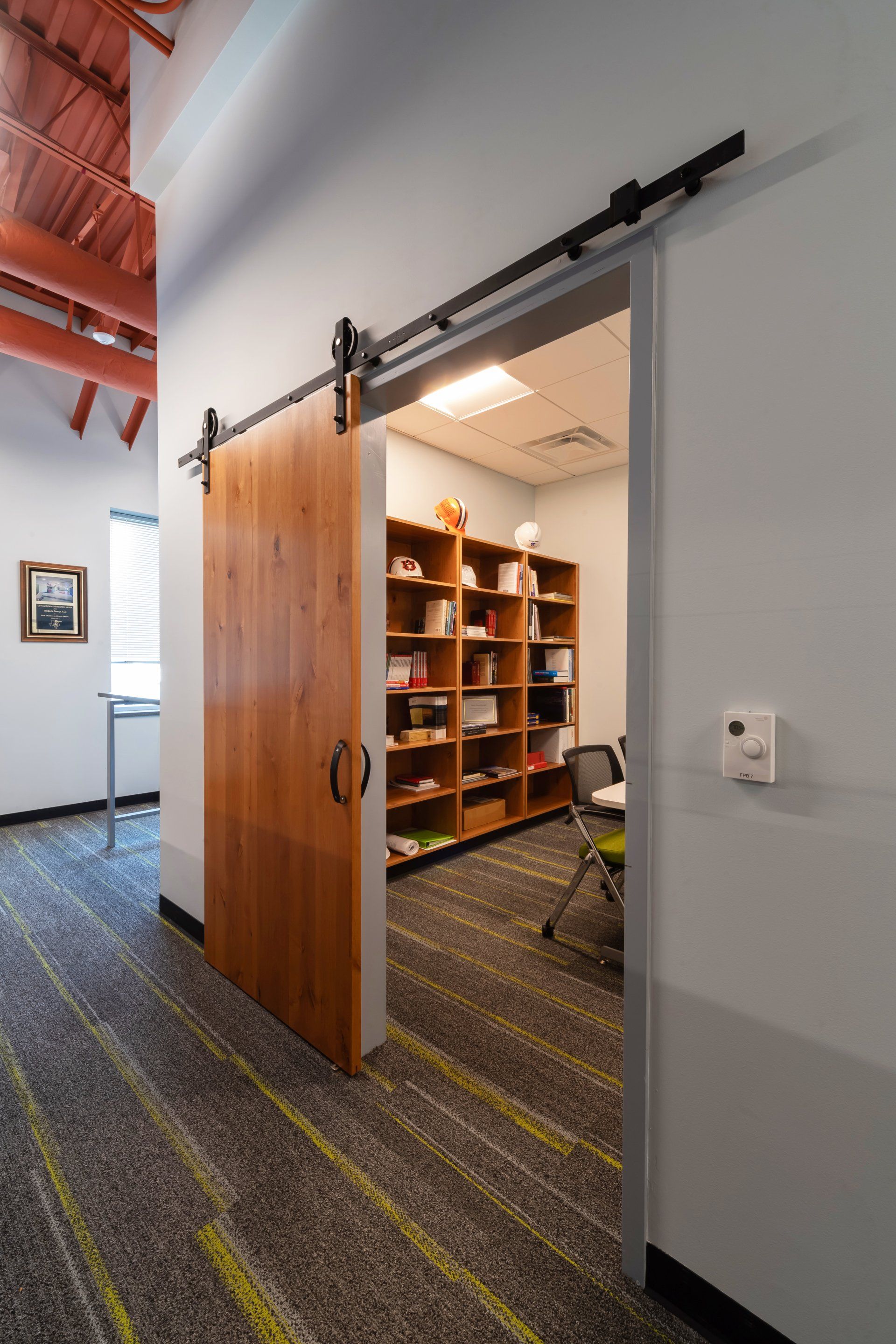 conference area with sliding barn door