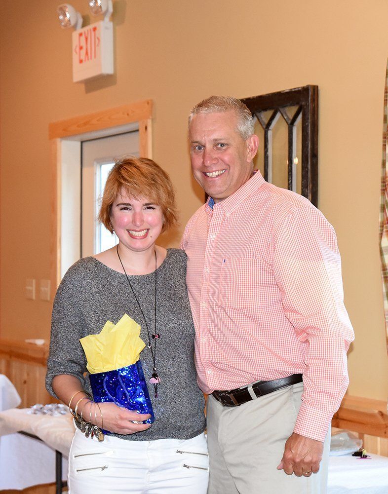 Sarah Banks with 2016.17 club president John E Fisher.