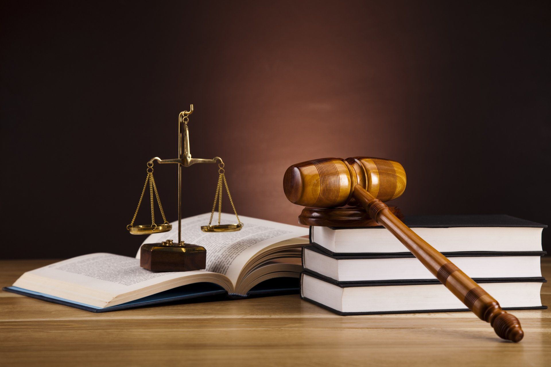 Tax Law in Little Rock — Gavel and Weighing Scale Above the Book in Little Rock, AR Tax Law in Little Rock — Gavel and Weighing Scale Above the Book in Little Rock, AR