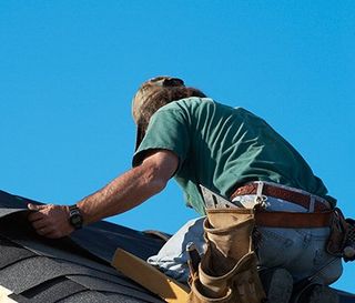 Roof Inspections — Worker Replacing the Roof in Port Richey, FL Roof Inspections — Worker Replacing the Roof in Port Richey, FL