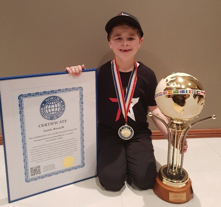 Youngest person to back flip on a scooter to timber ramp: world record set by Jamie Russell