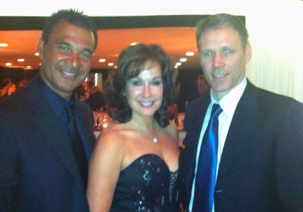 corrinne and rudd with their friend at a restaurant