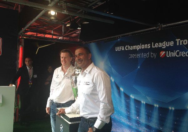 ruud posing next to a cup
