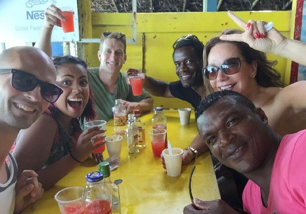 corrinne with her friends at a yellow table