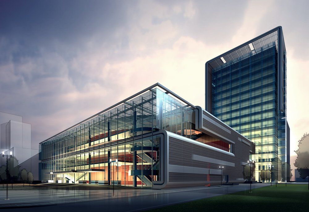 Modern glass and steel office buildings under a cloudy sky.