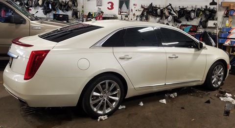 Car Window Repair — Mechanic Working In Auto Repair Shop in Chicago, IL Car Window Repair — Mechanic Working In Auto Repair Shop in Chicago, IL