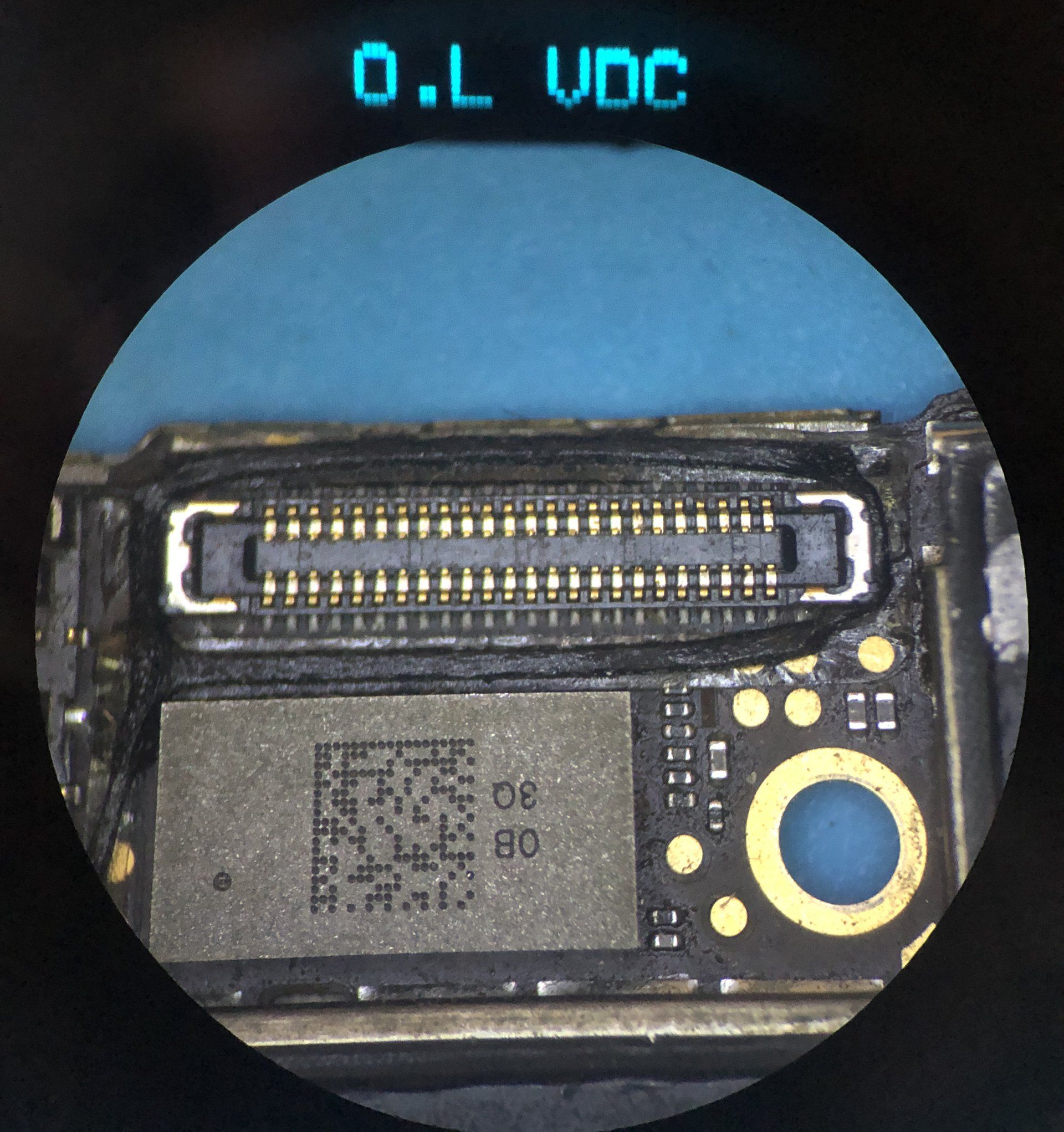 A microscope view of a port and readouts at the top of the view.