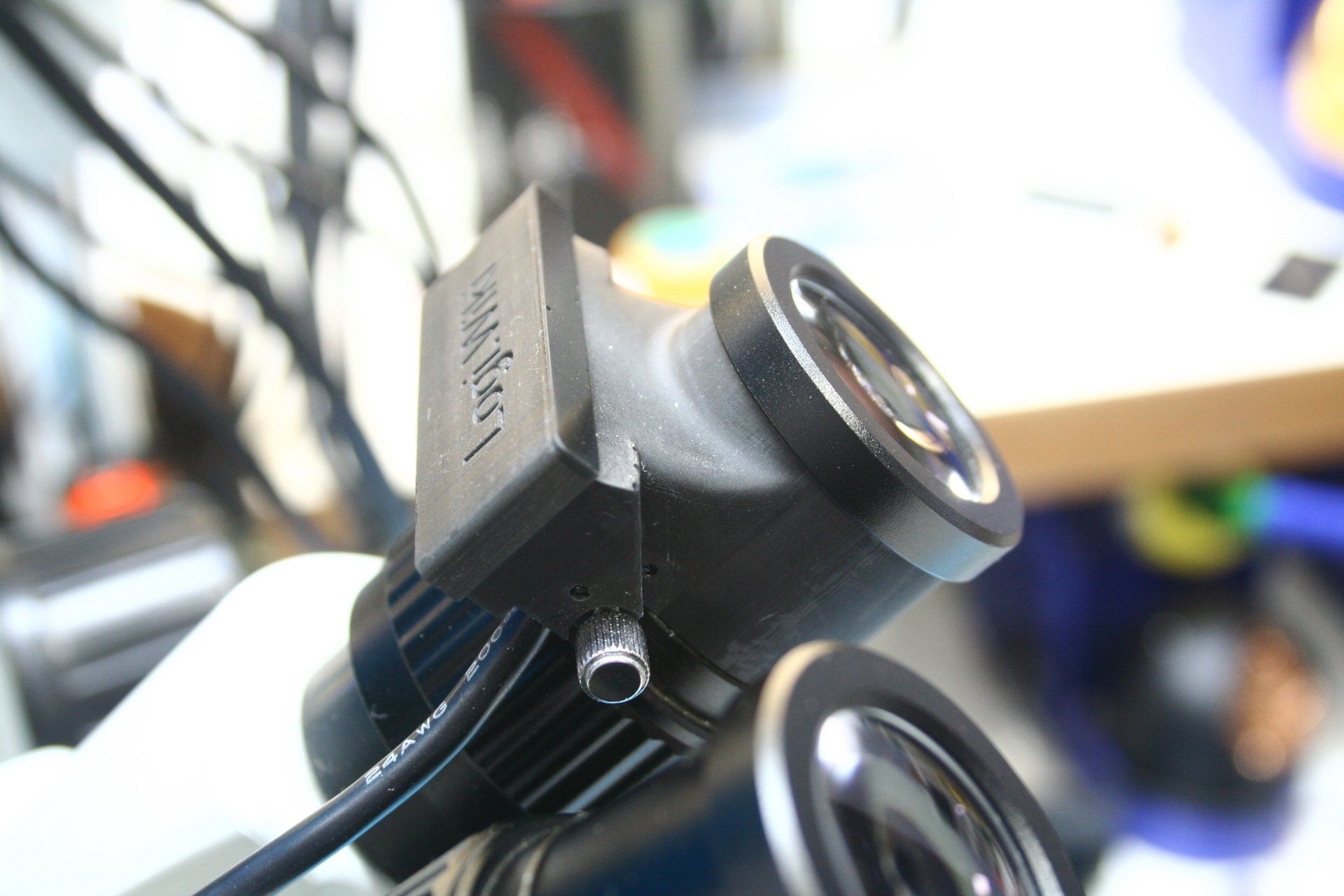 A close up side view of the 1i installed in a microscope.