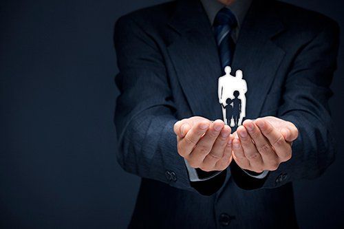 Man Holding Family Graphics - insurance in Pueblo, CO