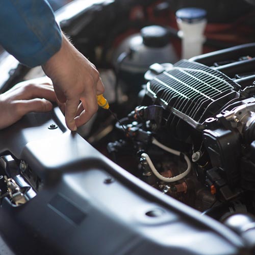 Car mechanic working in auto repair service