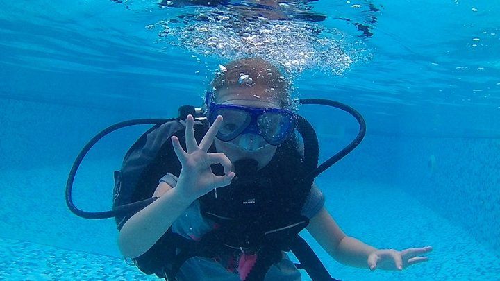 A child scuba diving